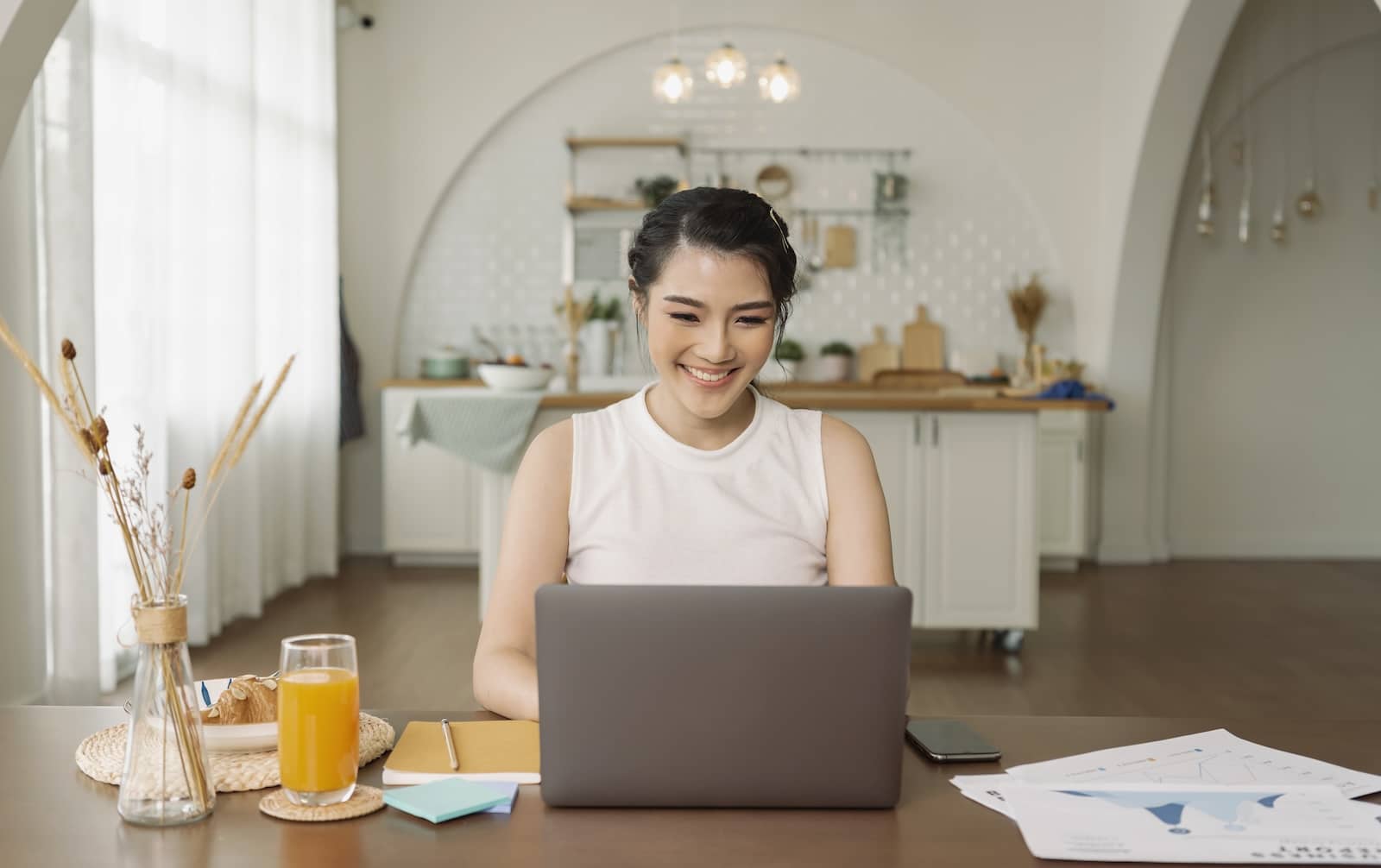 Beautiful young asian woman working on laptop computer